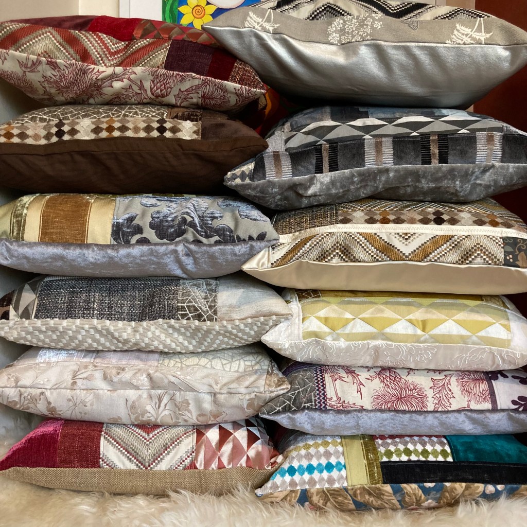 Image features two piles of pillows next to each other